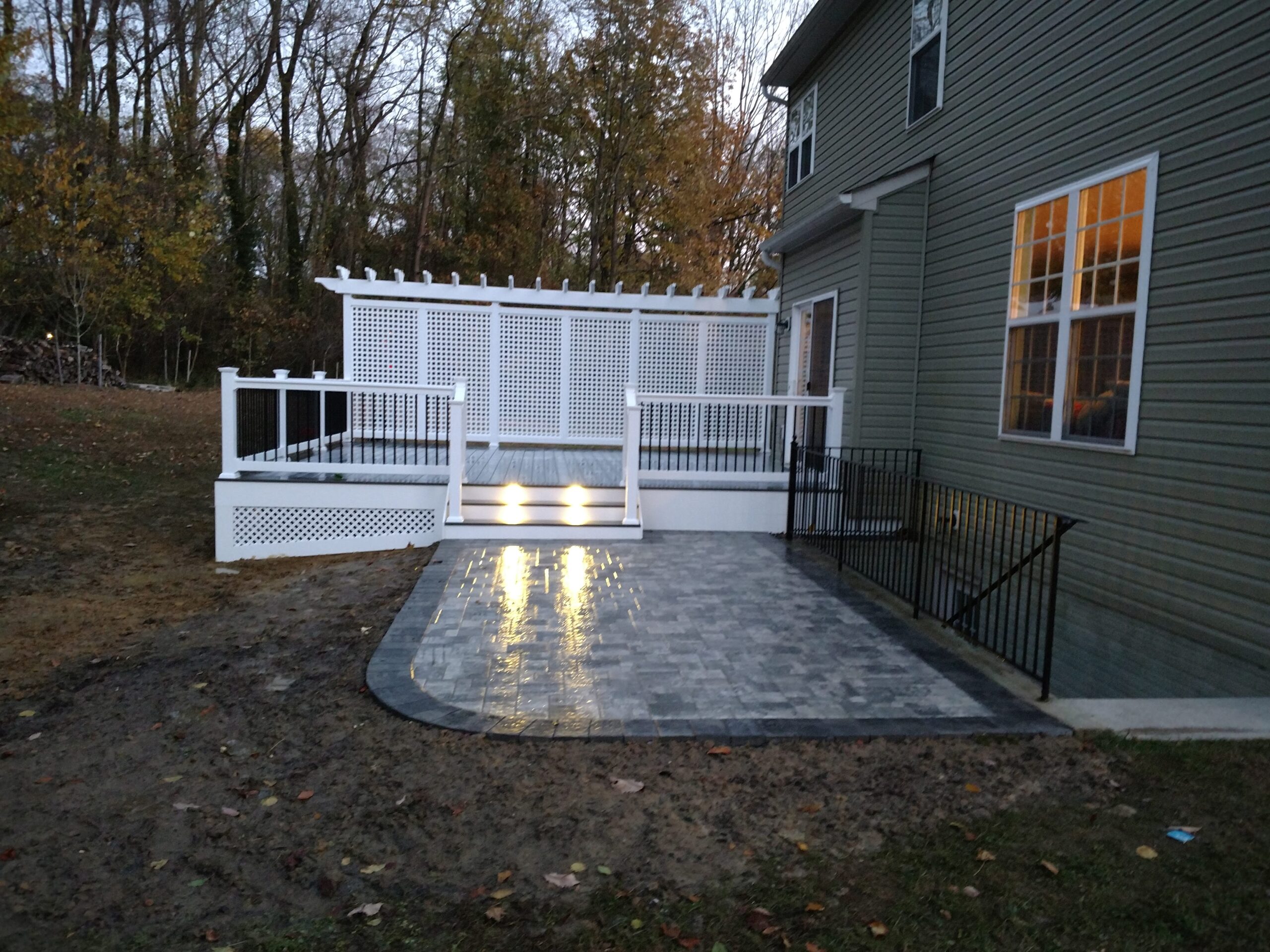 Deck with Patio and Lights by Nevins Constrution
